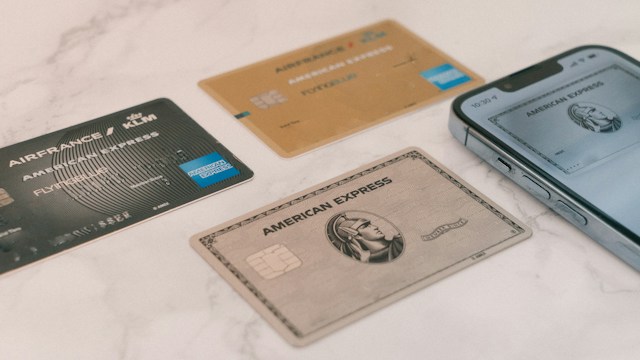 Credit cards and a smartphone on a marble surface